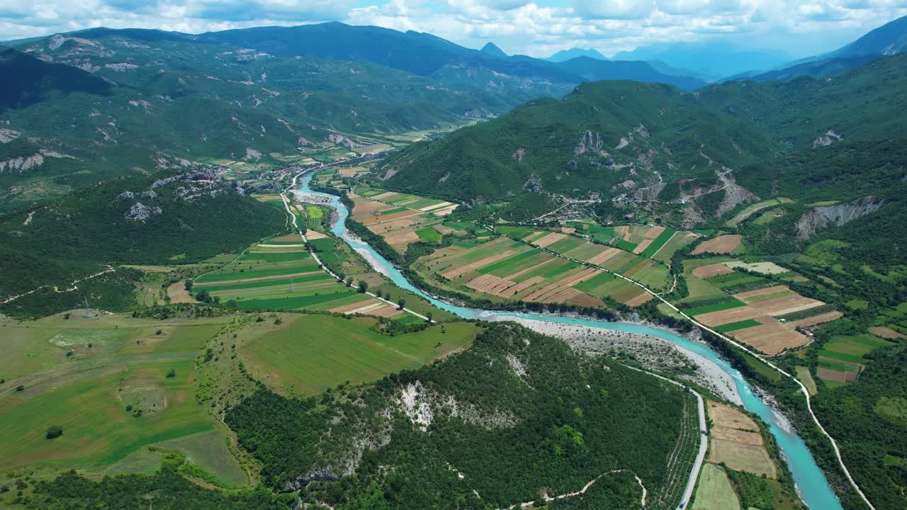 Vjosa River Turquoise Winding Flow Panoramic Aerial Over Green Fields and Hills Near Permet