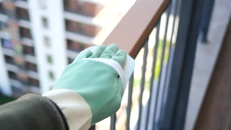 cleaning a balcony railing