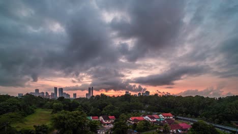 dramatic time lapse of the johor bahru skyline - incredible sunrise with fast moving clouds at the day begins - malaysia