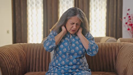 aged indian woman suffering from neck pain