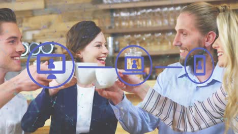 animation of digital icons over diverse business people drinking coffee