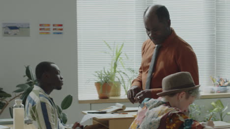 teacher and diverse students interacting in a classroom setting
