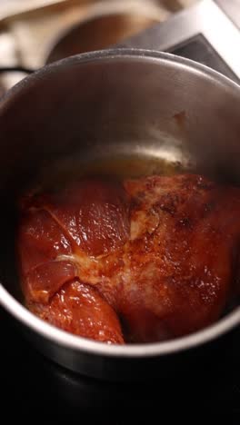 cooking pork in a pan