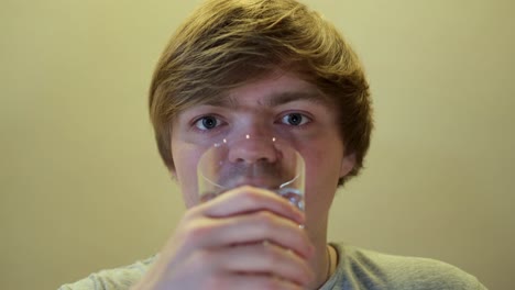 young man drinking water