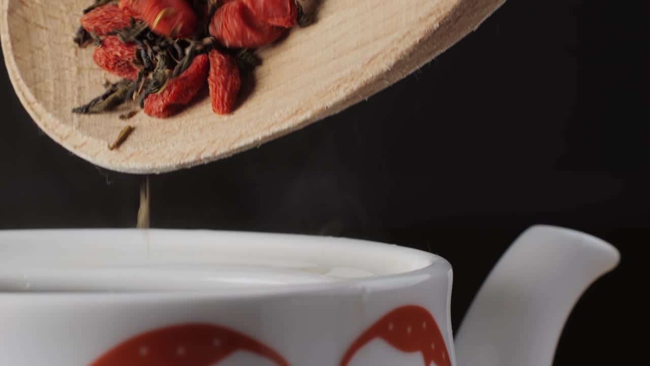 Preparing a healthy green tea with goji berries