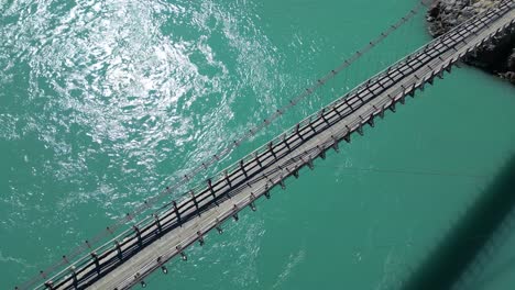 aerial overhead view of kowardo suspension bridge over the indus river in skardu