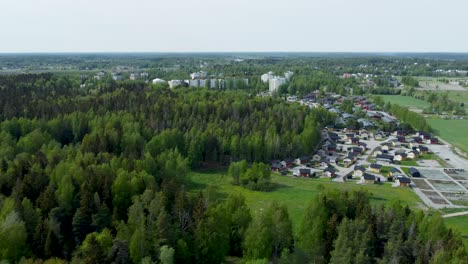depicted is a quaint town nestled beside a serene forest, creating a picturesque setting where nature and civilization harmoniously coexist