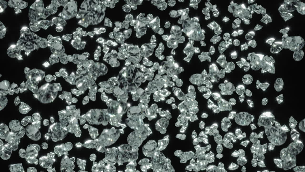 슬로우 모션으로 검은 배경에 대해 회전하고 떨어지는 다이아몬드