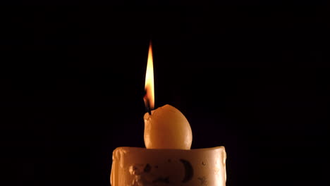 christmas candle decoration on black background