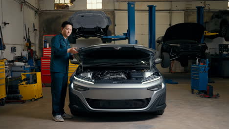 a mechanic inspecting a car's engine in an auto repair shop