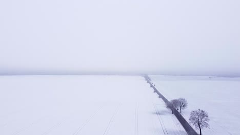 farmland covered with a thin layer of snow
