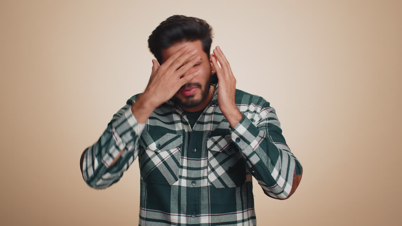 Bearded indian man loses becoming surprised by lottery results bad fortune loss unlucky news