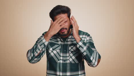 bearded indian man loses becoming surprised by lottery results bad fortune loss unlucky news