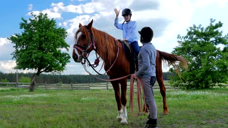 the man seat next the boy on the horse