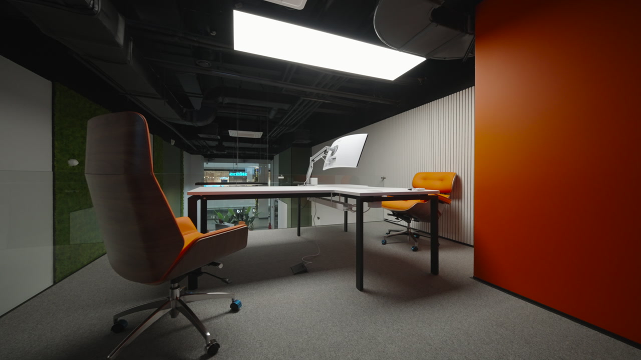 Empty Collaborative Workspace With Orange Chairs, Curved Desk And Monitor Mount, Muted Carpet, Open Ceiling. Creative