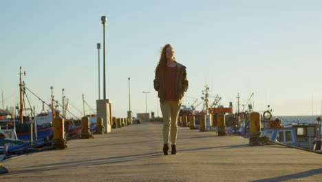 woman walking on the dock 4k