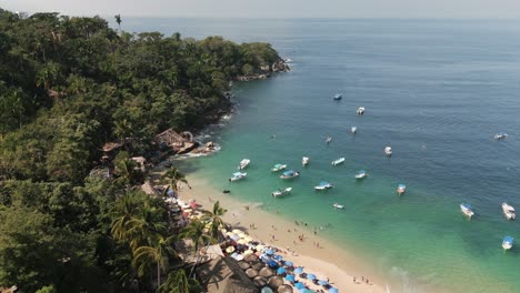 aerial panoramic landscape of mismaloya paradisiacal beach blue ocean coastline in mexican summer, boats around turquoise bay