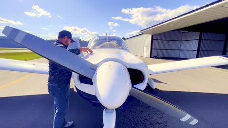 Pilot-goes-through-checklist-and-prefilight-inspection-of-Piper-Cherokee-180-prior-to-flight