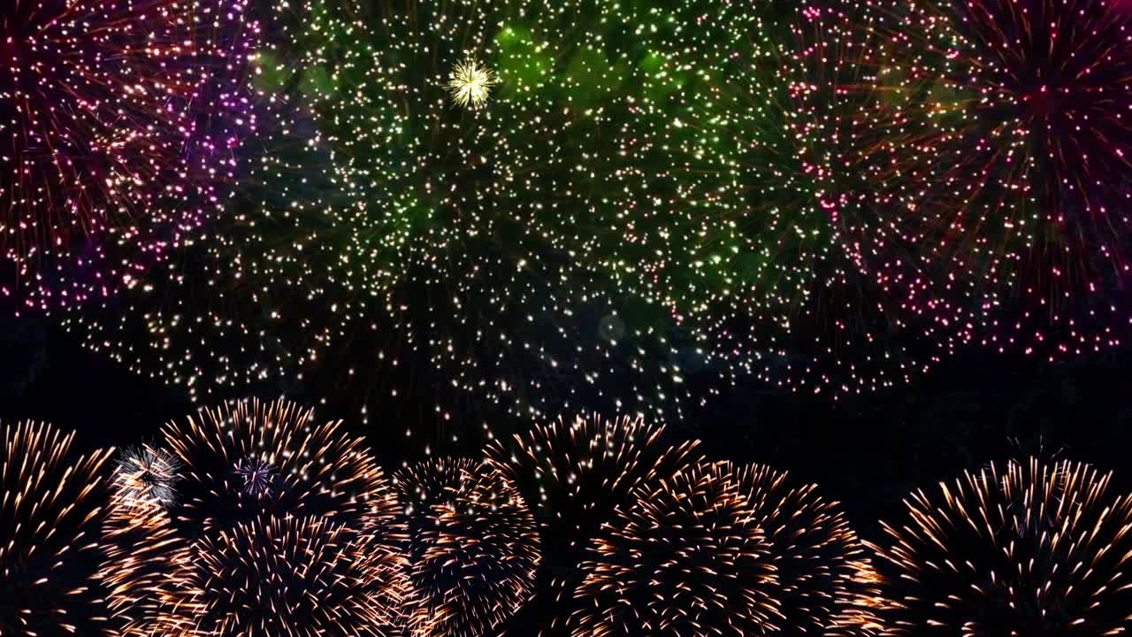 Brightly colorful christmas fireworks on twilight holiday background with fireworks and stars