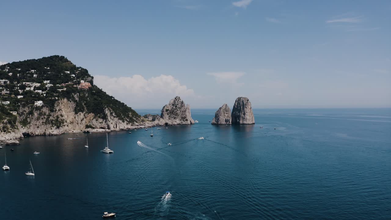Aerial view of the Tyrrhenian Sea surrounding Italy's coast on a bright summer day