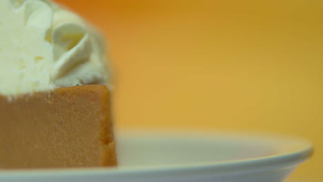 [camera used: canon c300] macro shot rotating pumpkin pie slice loaded with fluffy whipped cream