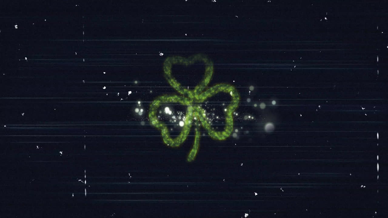 Green shamrock and fireworks animation over dark background with sparkling effects