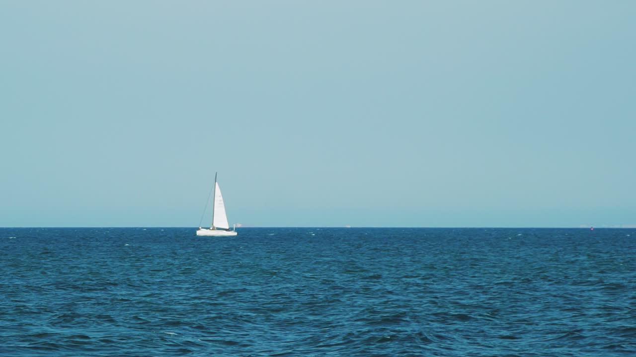 Yacht sailing on open sea at sunny day. Luxury yacht cruising at sea. Full open sails