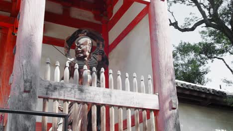 slide shot of guardian protecting the temple in kyoto, japan 4k slow motion