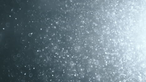 floating abstract particle bokeh on dark background