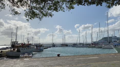 A-gentle-breeze-blows-as-boats-sit-in-their-slips-on-a-beautiful-sunny-day-nautical