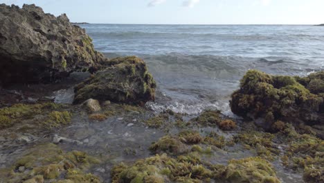 combination of rocks, ocean and water