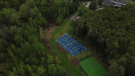above view of basketball court and sport field near schomberg, ontario, canada. aerial drone shot