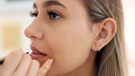 woman getting her makeup done