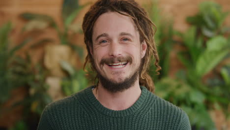 portrait of friendly young man laughing enjoying success lifestyle satisfaction caucasian male with dreadlocks hairstyle slow motion