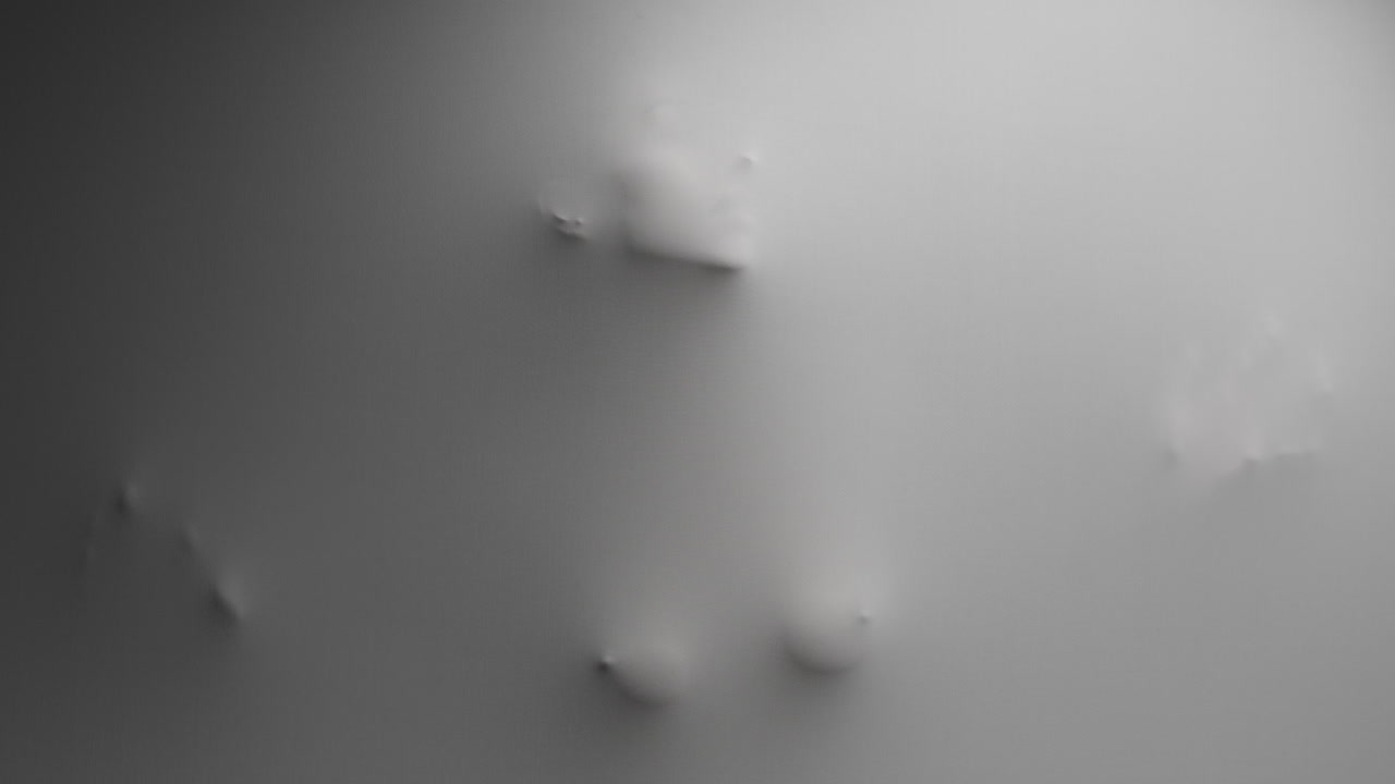 A scary silhouette of a woman appears from the white surface