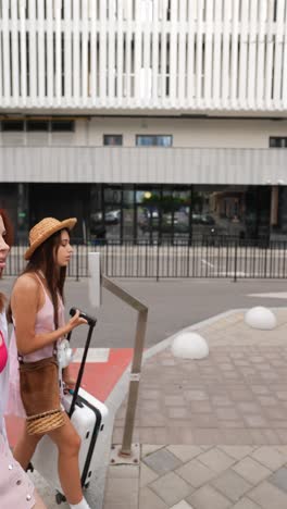 two women walking at an airport/urban setting