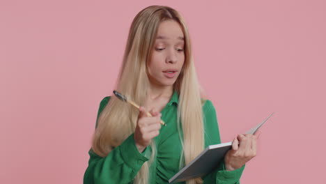 woman making notes, writing down thoughts with pen into notepad notebook diary to do list, good idea