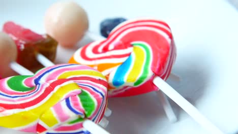 colorful lollipops and candies on a plate