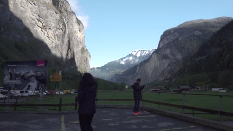 swiss valley with waterfall and mountains