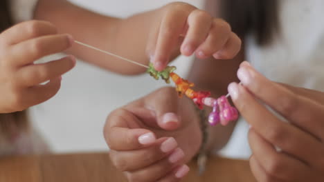 children making bracelets together