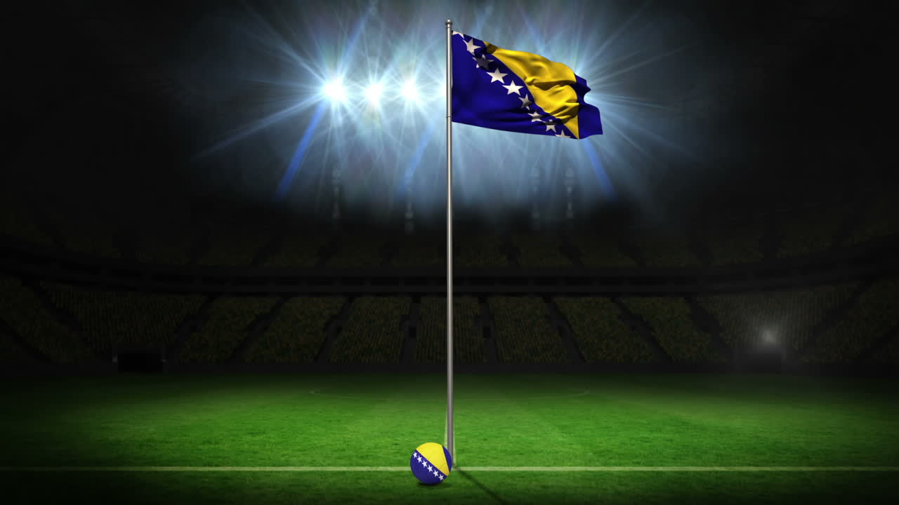 보스니아 국기가 기둥 위에 흔들리고 있다.