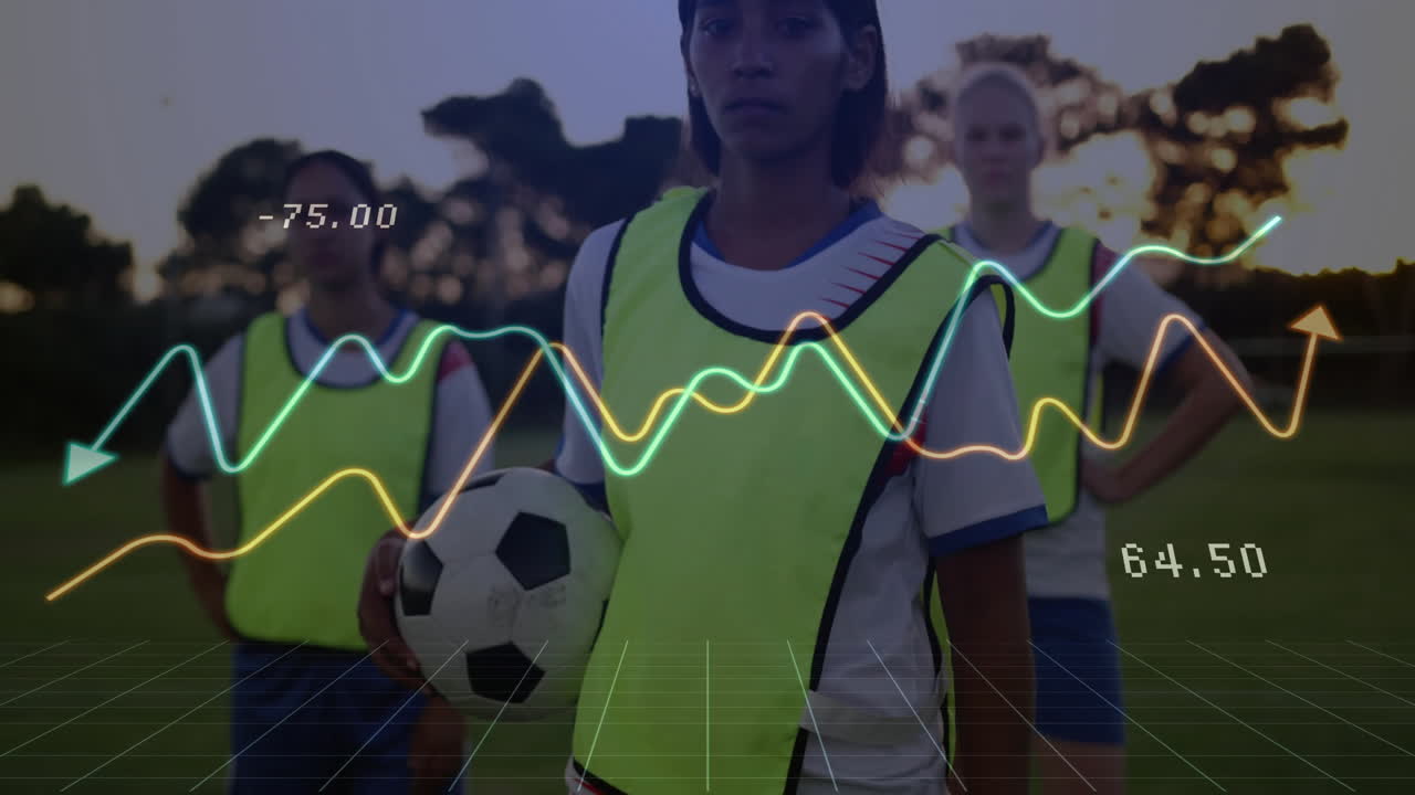 Three female soccer players training at dusk on pitch, showing analytics graphs and grid overlay