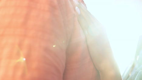 Love,-hands-and-couple-hug-at-a-beach-with-lens