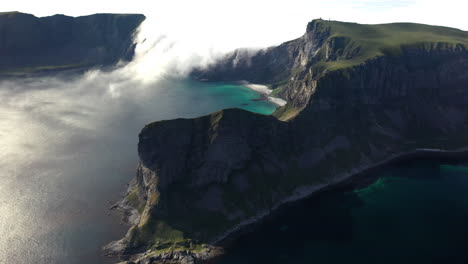 wide revealing aerial footage of the island of vaeroy, lofoten islands in norway