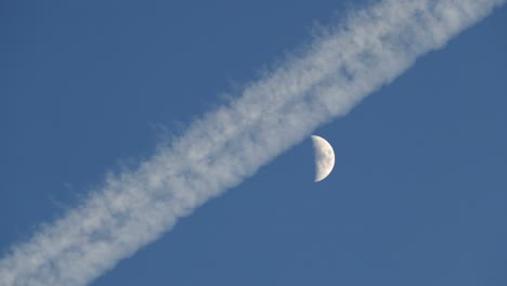 cloud of fog and moon, moon and airplane in the sky, fog cloud formed by the aircraft,