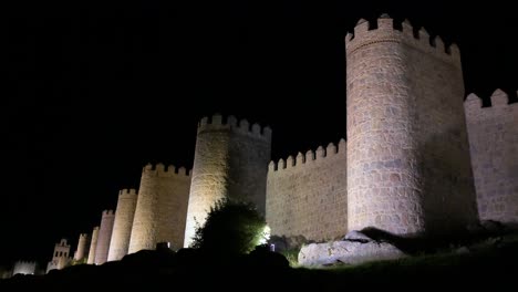 avila’s old town under the night sky, showcasing the bright, unesco-protected medieval walls in spain.