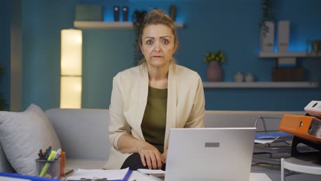 home office worker woman looking at camera curious and confused.
