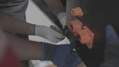 two man fixing the screw