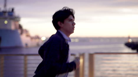 man running by the water