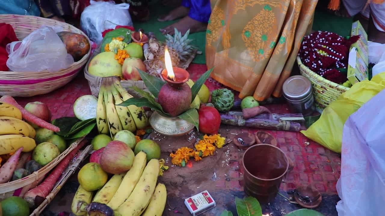 burning oil lamp with offerings during holy rituals at festival from different angle video is taken on the occasions of chhath festival which is used to celebrate in north india on Oct 28 2022